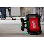 Image of the Milwaukee M18 Green Interior Rotary Laser Level Kit w/ Remote/Receiver & Wall Mount Bracket being used by a worker on a jobsite floor