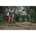 Worker using the M18 FUEL QUIK-LOK Brush Cutter Attachment