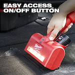 A person’s hand is holding a red M12™ AIR-TIP™ Utility Nozzle, which is being used on a carpeted surface. The text "EASY ACCESS ON/OFF BUTTON" is displayed at the top of the image. The nozzle has built-in LED lights and a prominent on/off button.