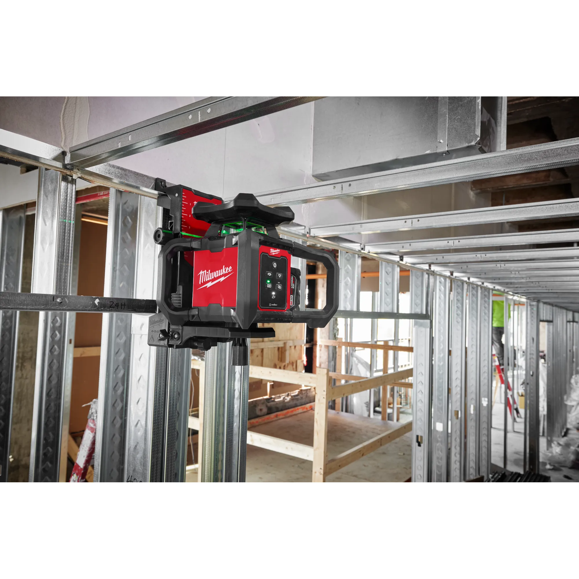 Image of the Milwaukee M18 Green Interior Rotary Laser Level Kit w/ Remote/Receiver & Wall Mount Bracket being used on a jobsite