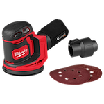 Milwaukee cordless random orbit sander with red and black color scheme. The sander includes a dust bag, an attachment, and three circular sanding pads. The Milwaukee logo is visible prominently on the side of the tool.