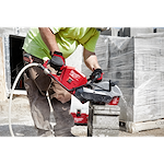 Image of the 9" DIAMOND MAX Segmented Turbo, General Purpose Diamond Blade being used by a worker on a jobsite to cut concrete block